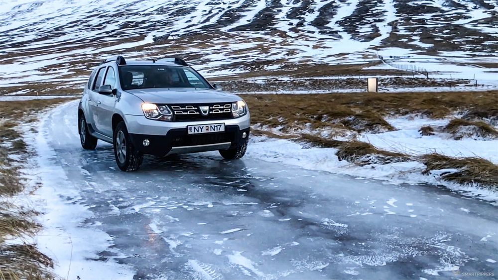 Our Duster on a completely icy side road.